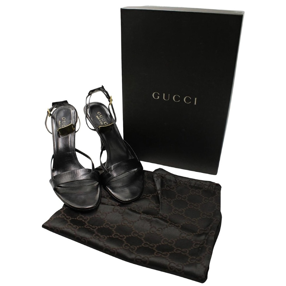 Gucci Strappy Sandals with Gold Logo Plaque in Black Leather